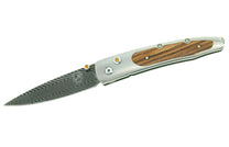Silver folding knife with brown wood handle inlay and wavy Damascus patterned blade, featuring yellow accents.