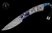 Damascus steel folding knife with a blue and purple patterned handle, ornate silver scrollwork, a carved bust, and a black leather lanyard.