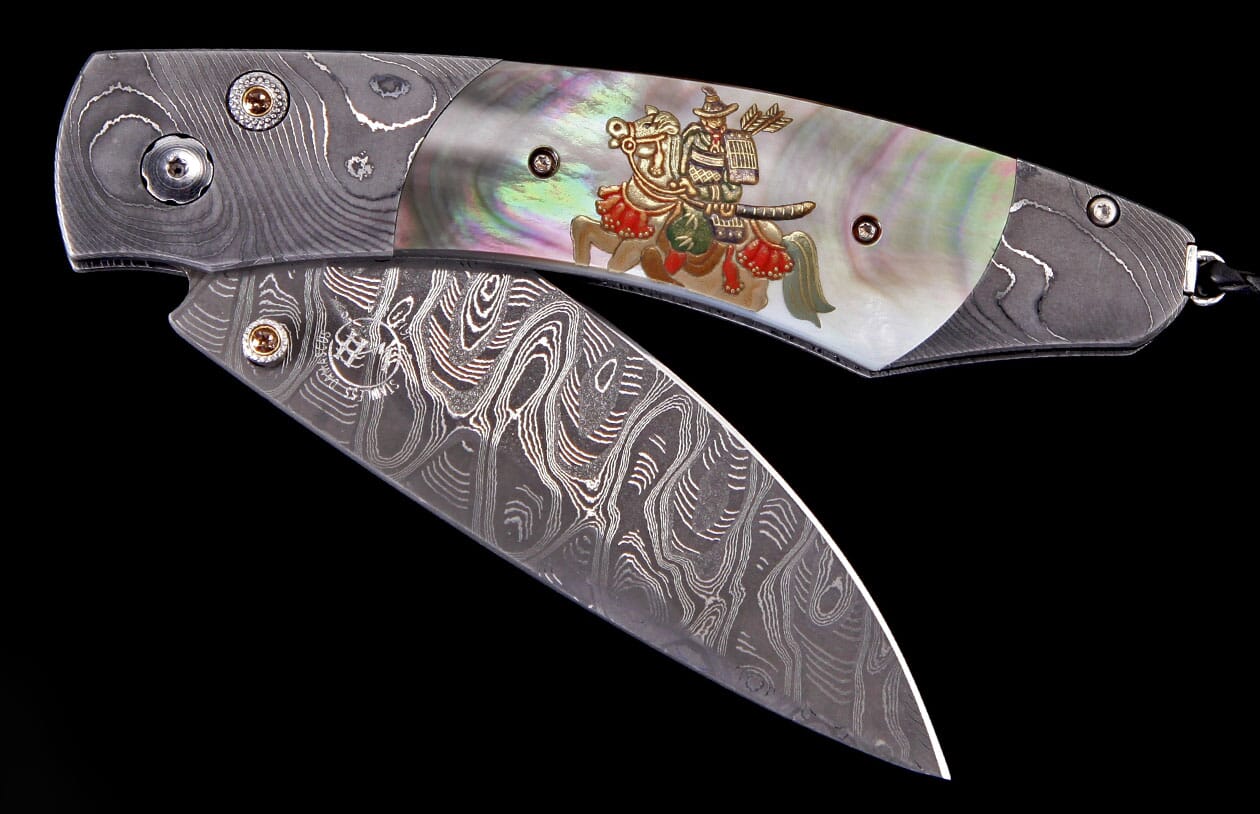 Ornate folding knife with a wavy Damascus steel blade, iridescent mother-of-pearl handle, and a gold Samurai warrior inlay.