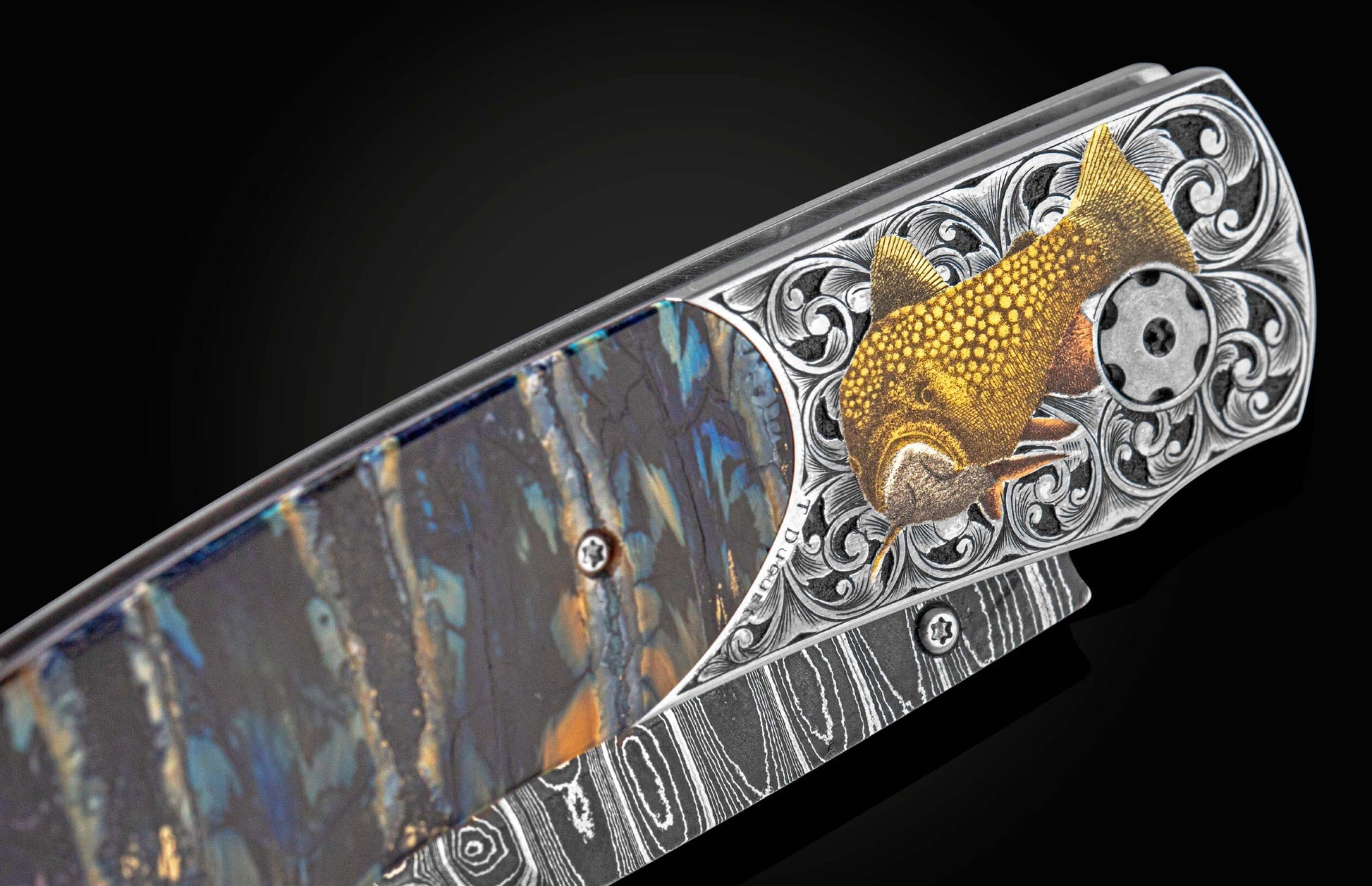 William Henry knife features a hand-engraved bolster with 24K gold