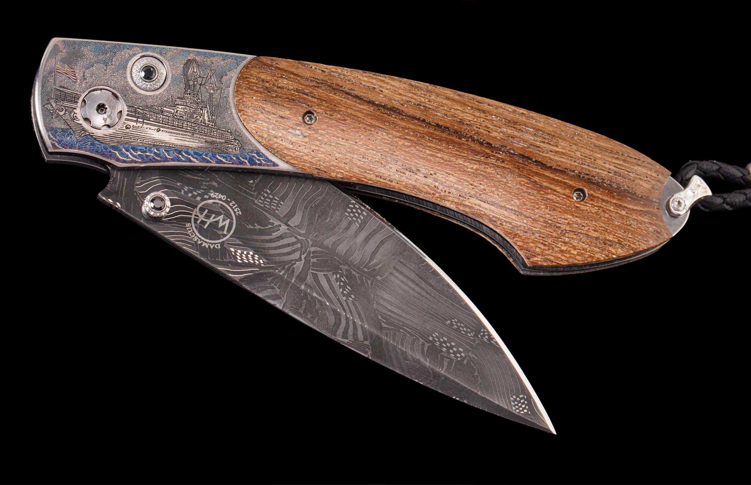 Custom William Henry knife featuring the USS California laser engraved by Bottega Incisioni, inlaid with teak from the USS California battleship, spinel gemstones, and hand-forged damascus steel blade by Chad Nichols.
