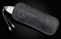  and a hand-forged Damascus steel blade by Mike Norris