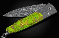 Handcrafted knife from William Henry features hand-forged 'Twist' damascus steel by Chad Nichols, inlaid with a  stunning scale of Mojave Green turquoise & copper, with spinel gemstones.