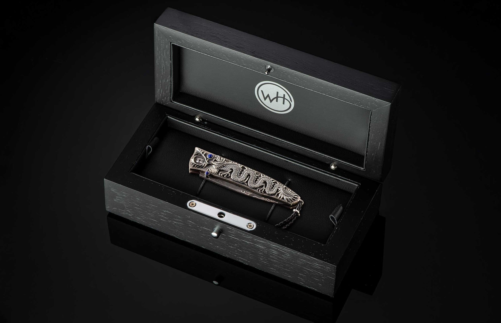 The GenTac Sterling Silver Dragon Pocket Knife in a case