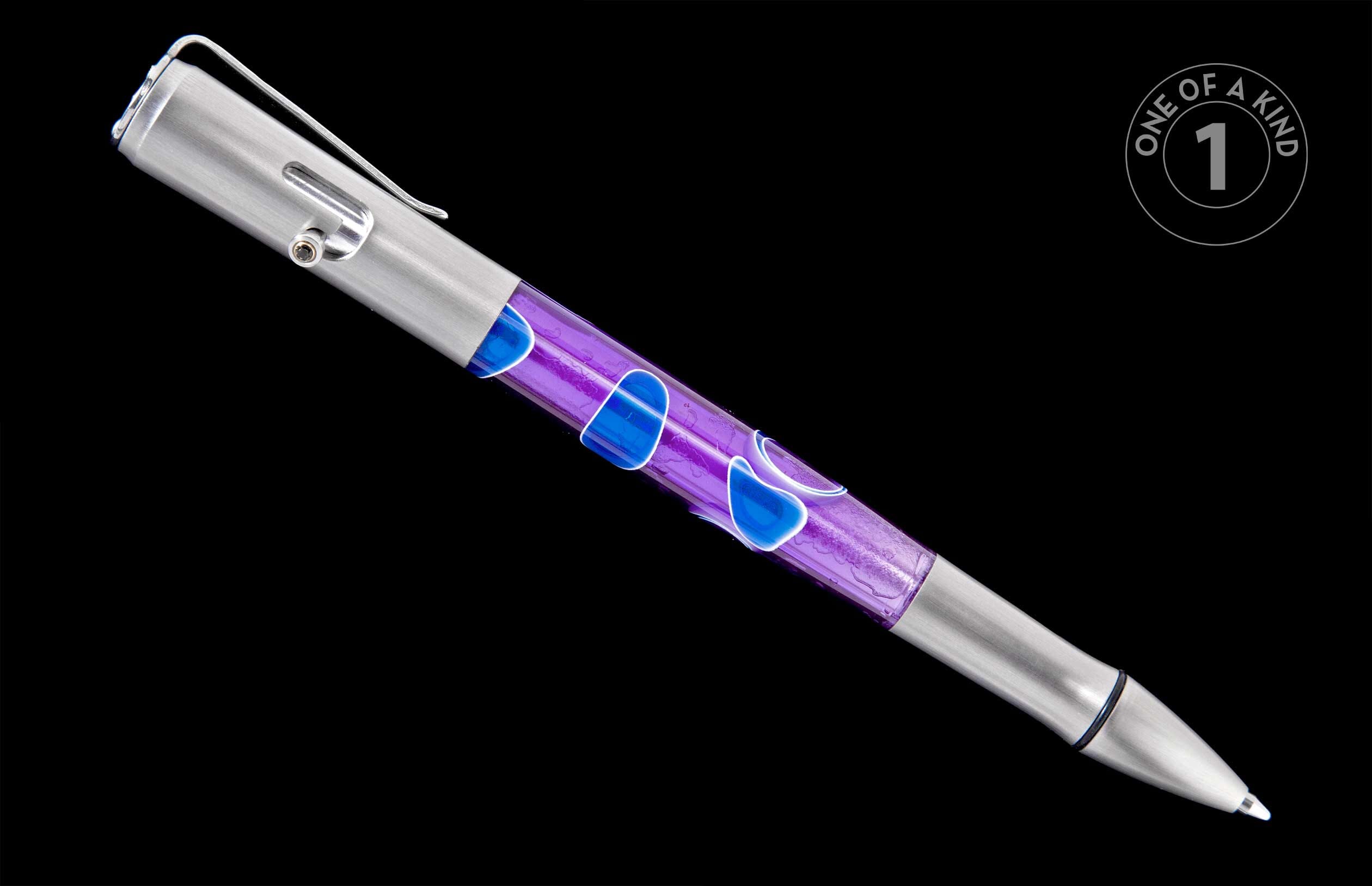 A piece of jewelry designed as a brushed silver pen with a translucent purple barrel and blue liquid shapes.