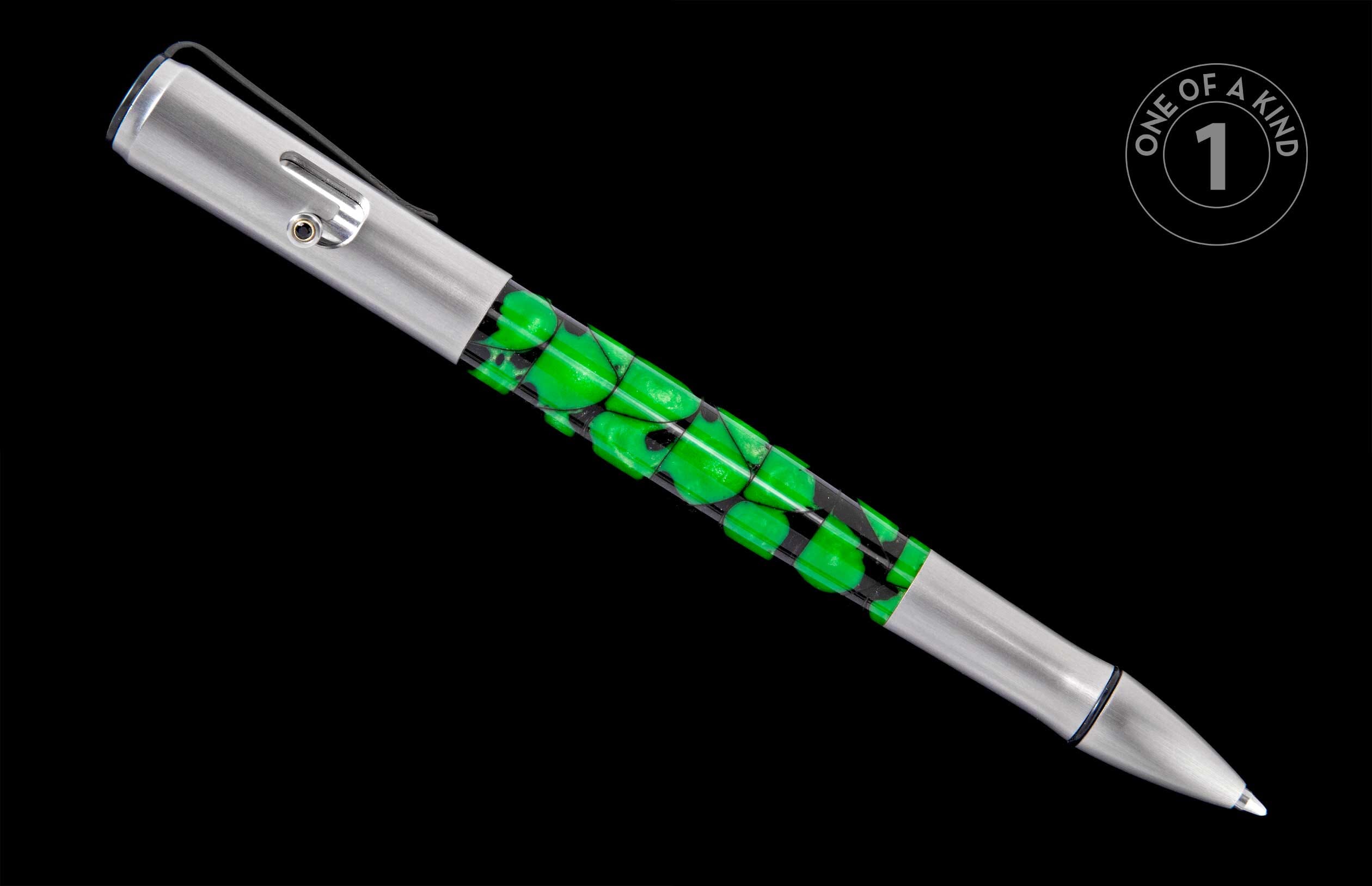 Silver brushed metal pen with a bright green, black-outlined mosaic body and a clip featuring a dark stud, angled.