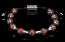 Bracelet with reddish-brown marbled stone beads, silver-toned cylindrical spacers, black braided cord, and textured rectangular clasp.