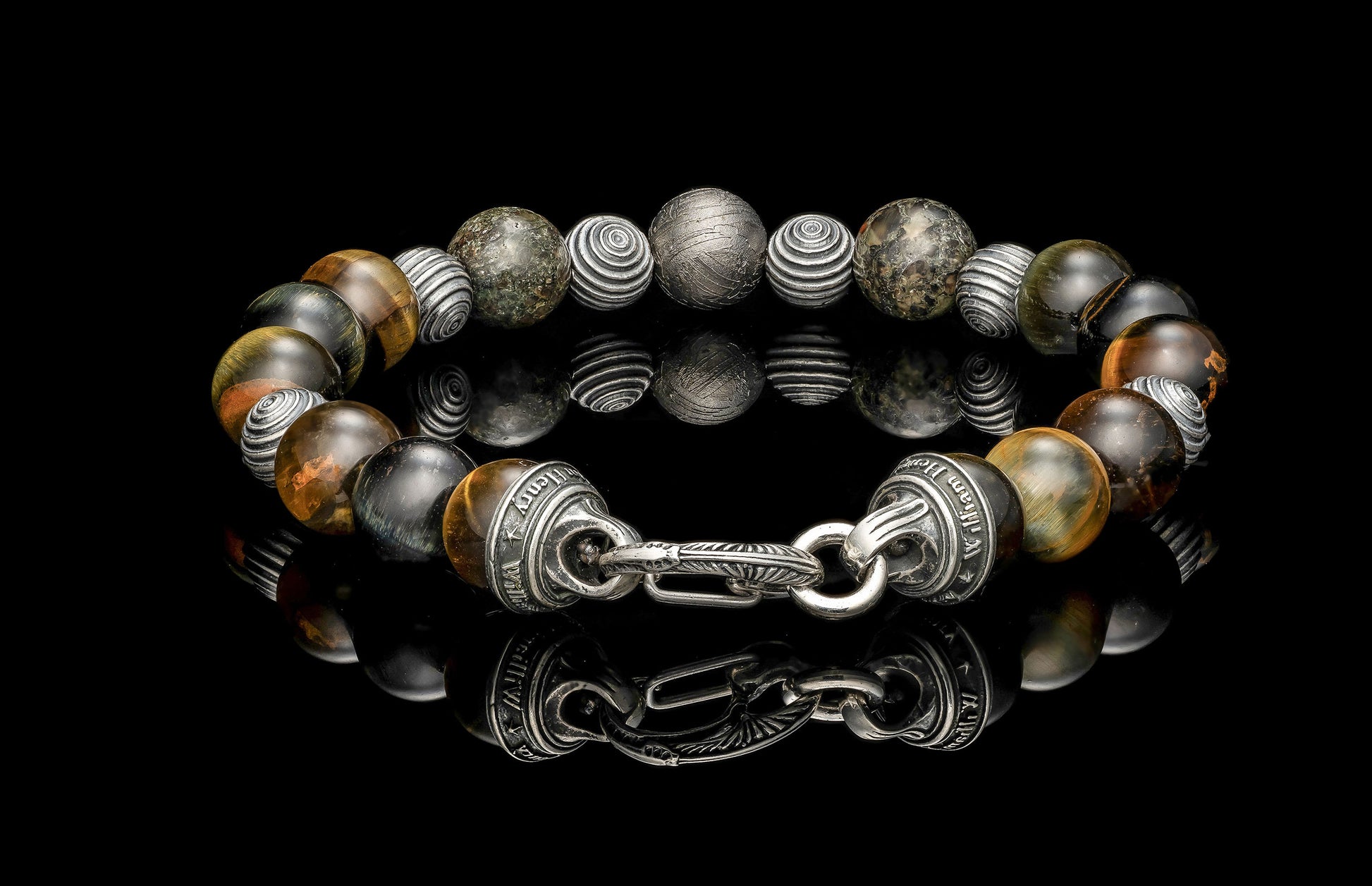 Beaded bracelet with meteorite, dinosaur bone, and Tiger's Eye beads