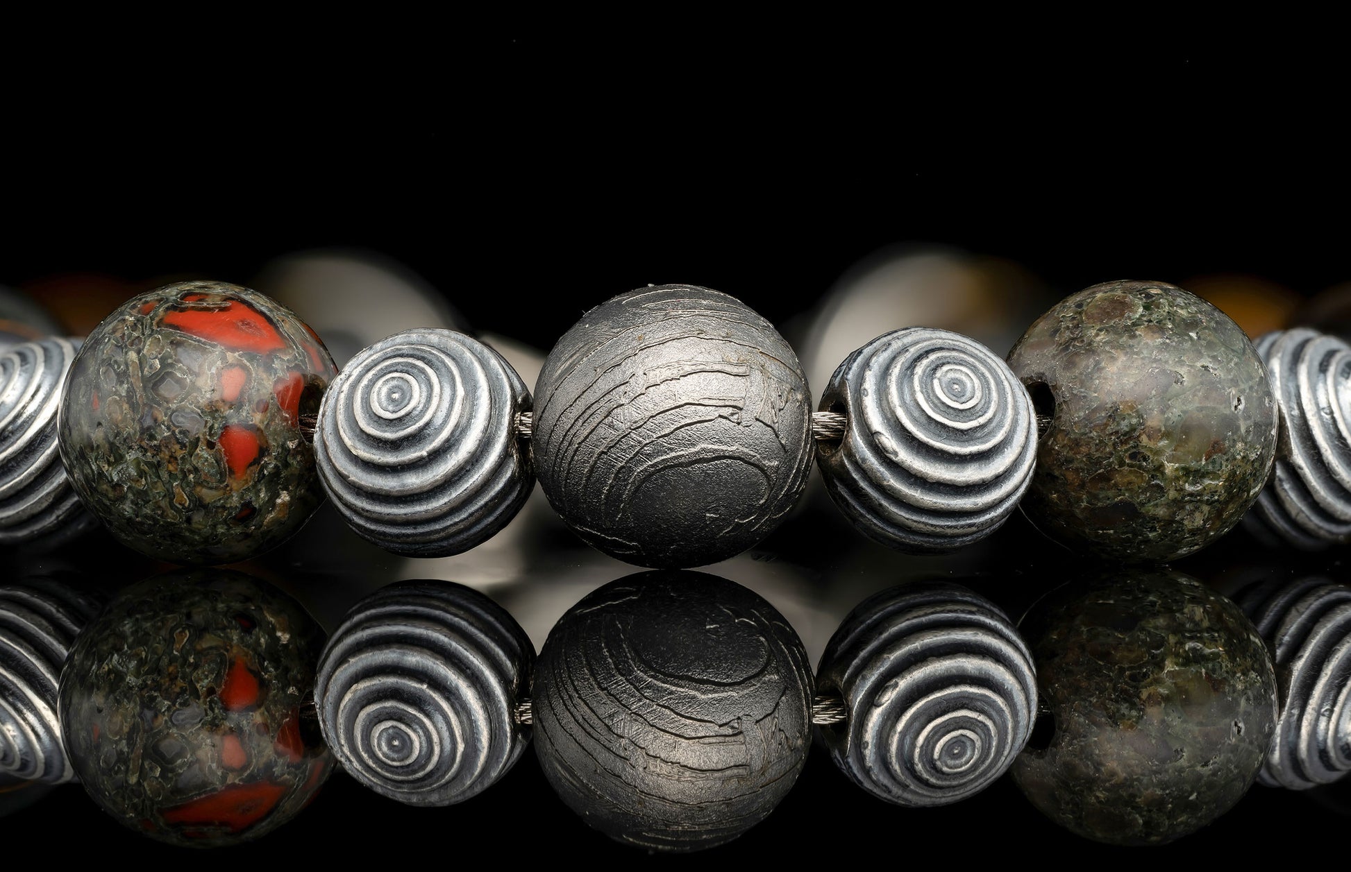 Beaded bracelet with meteorite, dinosaur bone, and Tiger's Eye beads