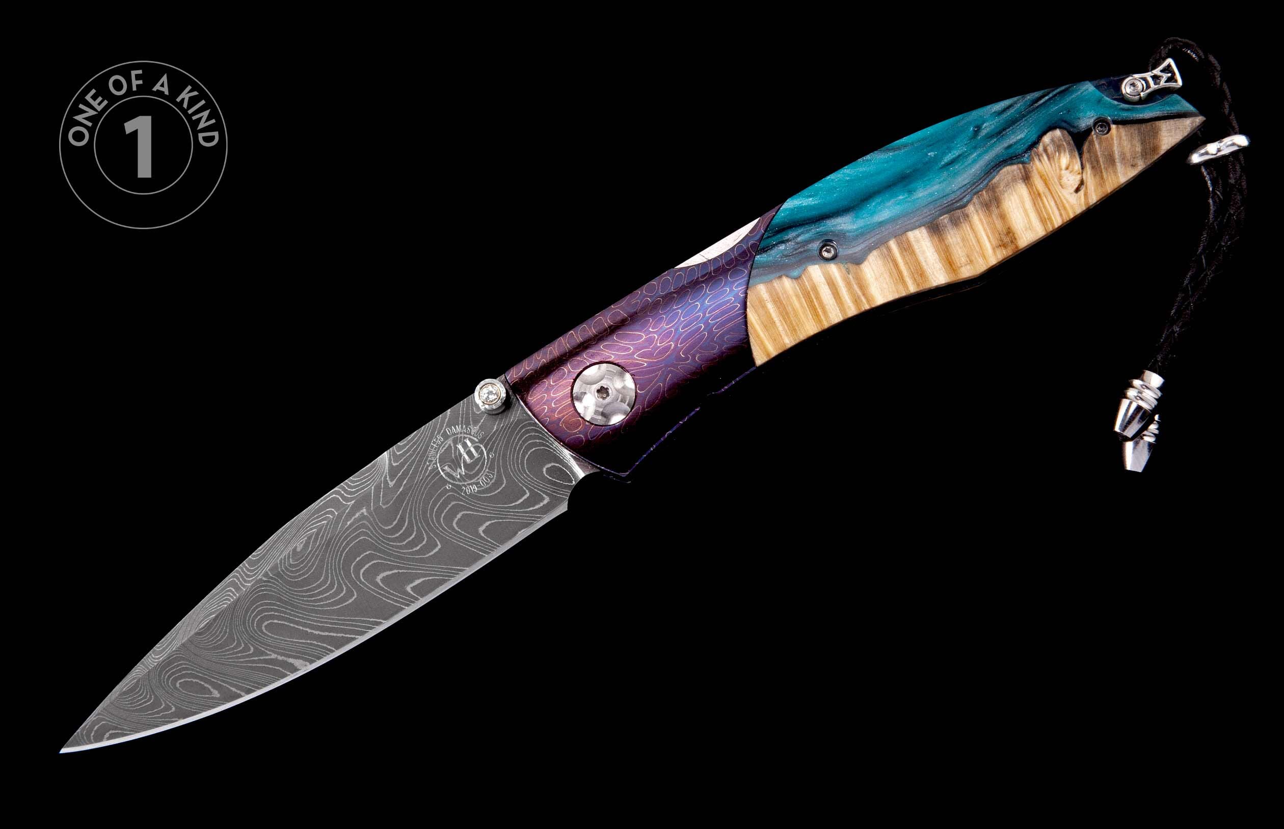 Folding knife with a patterned Damascus blade, purple etched handle, and turquoise resin and wood inlay, featuring a black lanyard.