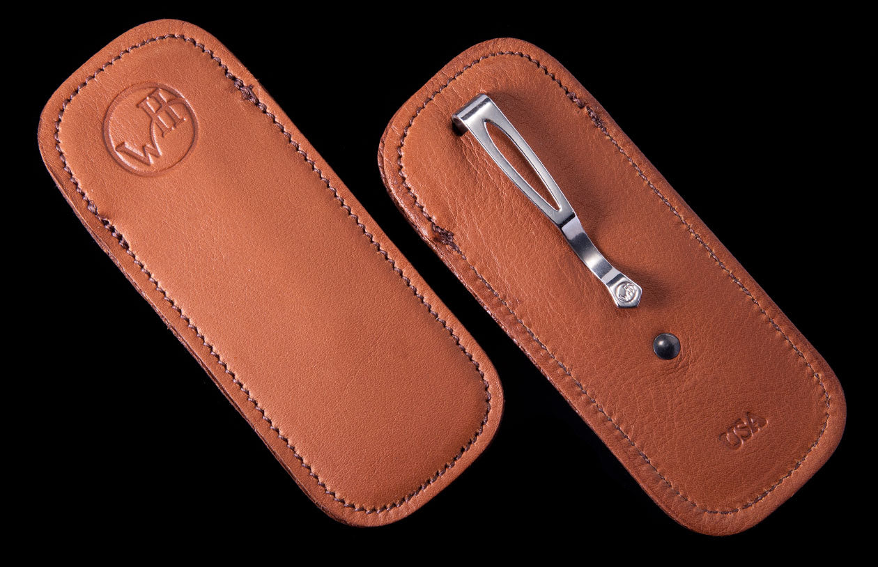 SHEATH 5|Two brown leather ClipCase sheaths, one with an embossed 'WH' logo, the other with a silver pocket clip and 'USA' stamp.