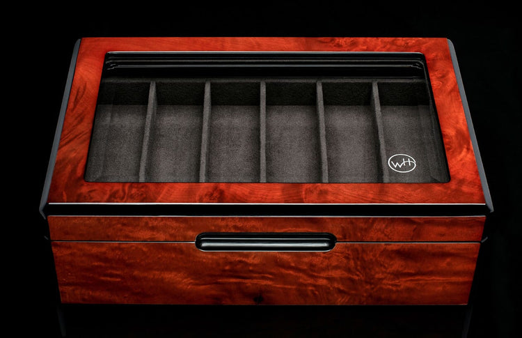 Reddish-brown burled wood collector display case with clear top, six grey velvet compartments, white logo, and a lower drawer with black handle.