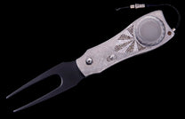 Luxury multi-tool knife with a silver-tone, diamond-encrusted handle featuring a sunburst pattern, black divot repair prongs, and a ball marker.