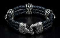 Black braided leather bracelet with ornate silver-toned warrior-themed metal beads and a detailed hook clasp.