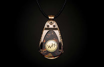 Dark mottled pendant with a bronze-toned frame, featuring a gold 'WH' emblem, on a black braided cord.