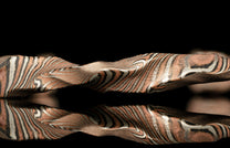 Close-up of a twisted bracelet with a unique pattern on a dark background