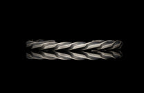 Metallic twisted bar on a black background