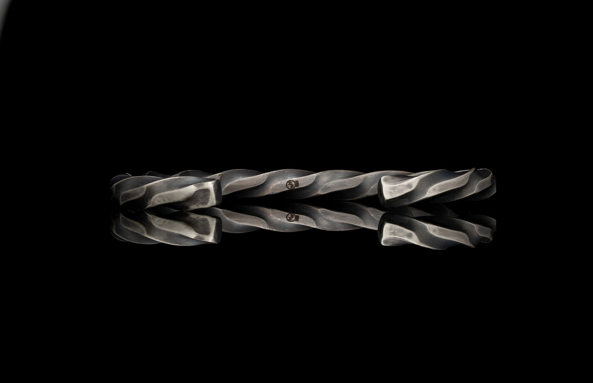 Twisted metal rod on a black background