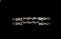 Twisted metal rod on a black background