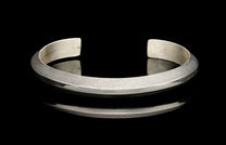 Silver bracelet on a black background