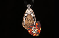 Bronze pendant featuring a bearded man's face, set in a silver-tone frame with a tortoiseshell Zac Brown Band guitar pick.