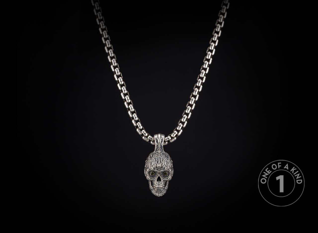 Sterling silver skull pendant necklace from William Henry with tourmaline gems.