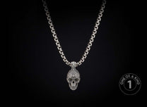 Sterling silver skull pendant necklace from William Henry with tourmaline gems.