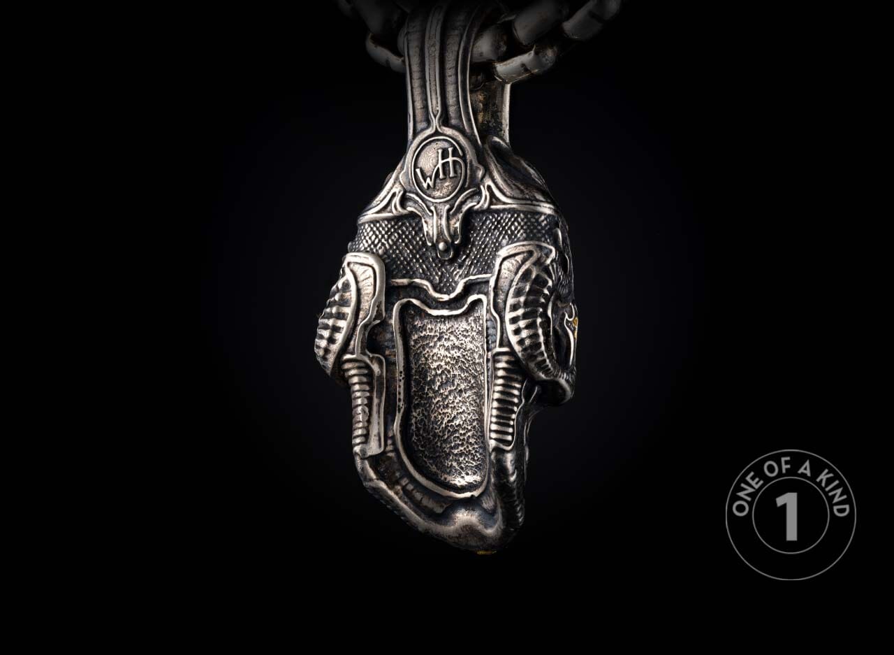 Sterling silver skull pendant necklace from William Henry with tourmaline gems.