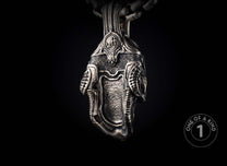 Sterling silver skull pendant necklace from William Henry with tourmaline gems.