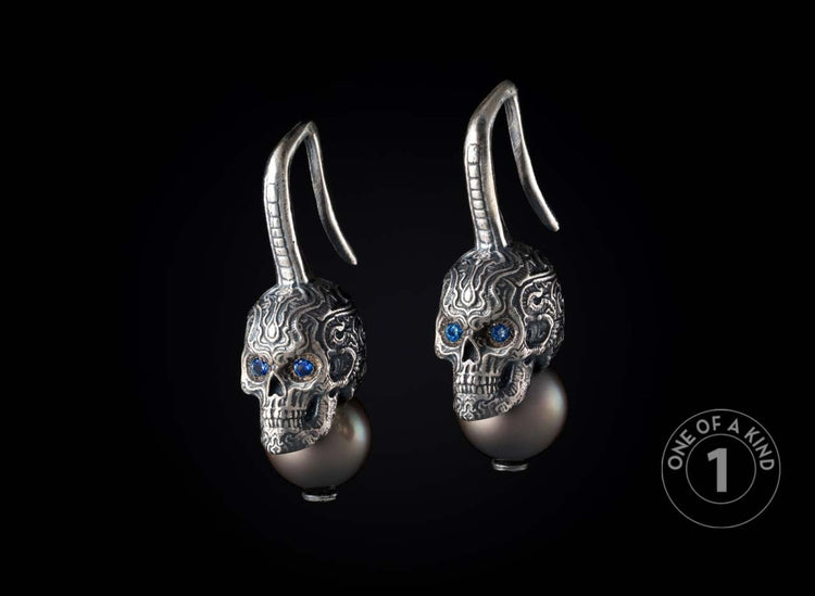 One of a kind earrings from William Henry featuring sapphires and South Sea pearls.