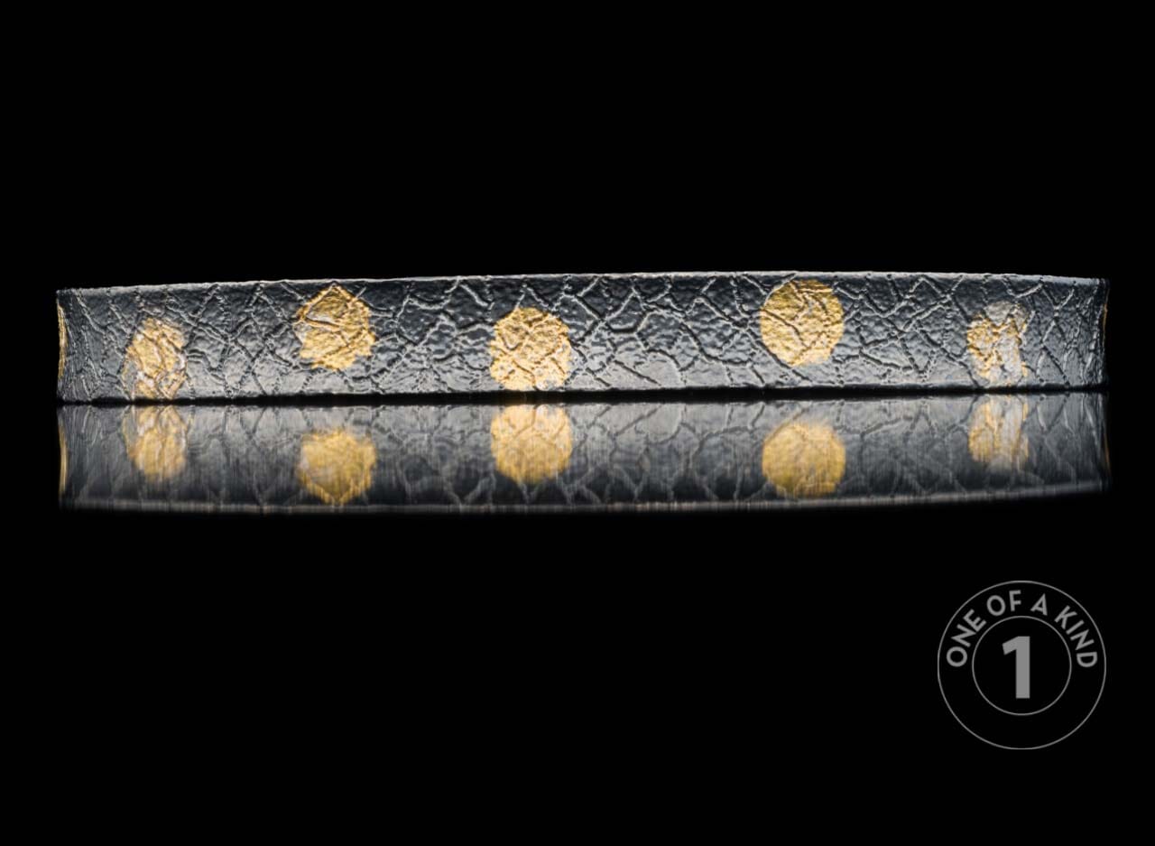 One of a kind cuff bracelet from William Henry featuring textured sterling silver and 23.5K Yellow gold