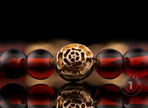 One of a Kind bracelet from William Henry featuring Cognac Amber beads and18K Rose gold beads.
