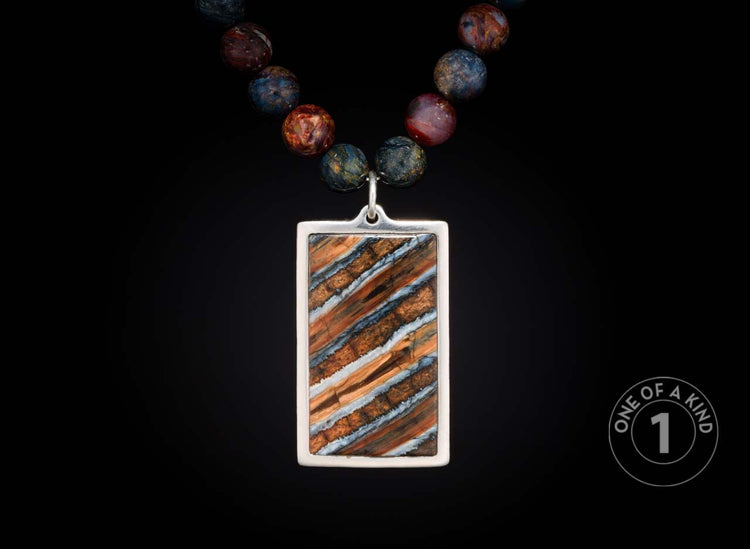 One of a kind sterling silver pendant necklace from William Henry with a mammoth tooth inlay and Pietersite beads.