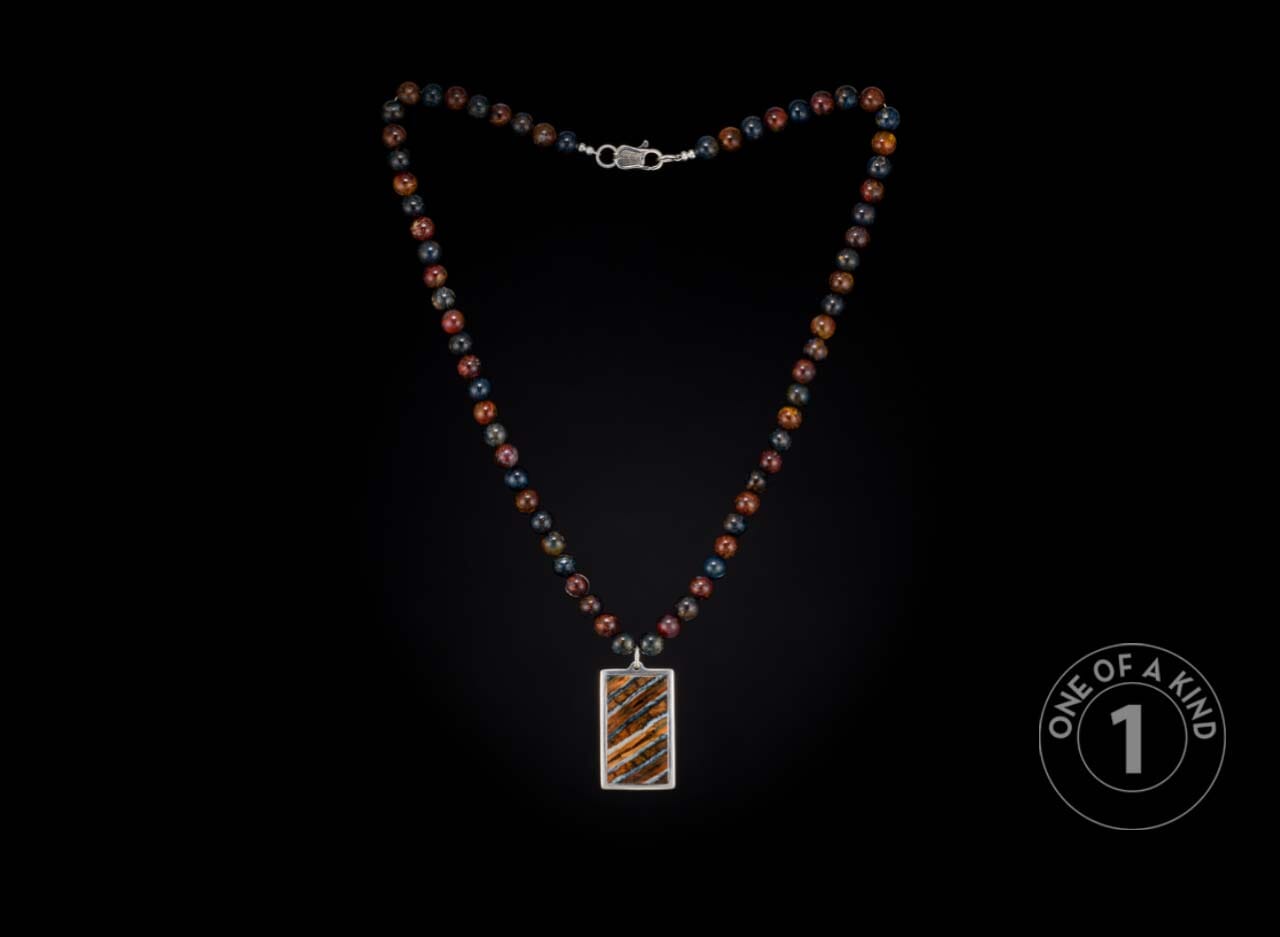 One of a kind sterling silver pendant necklace from William Henry with a mammoth tooth inlay and Pietersite beads.