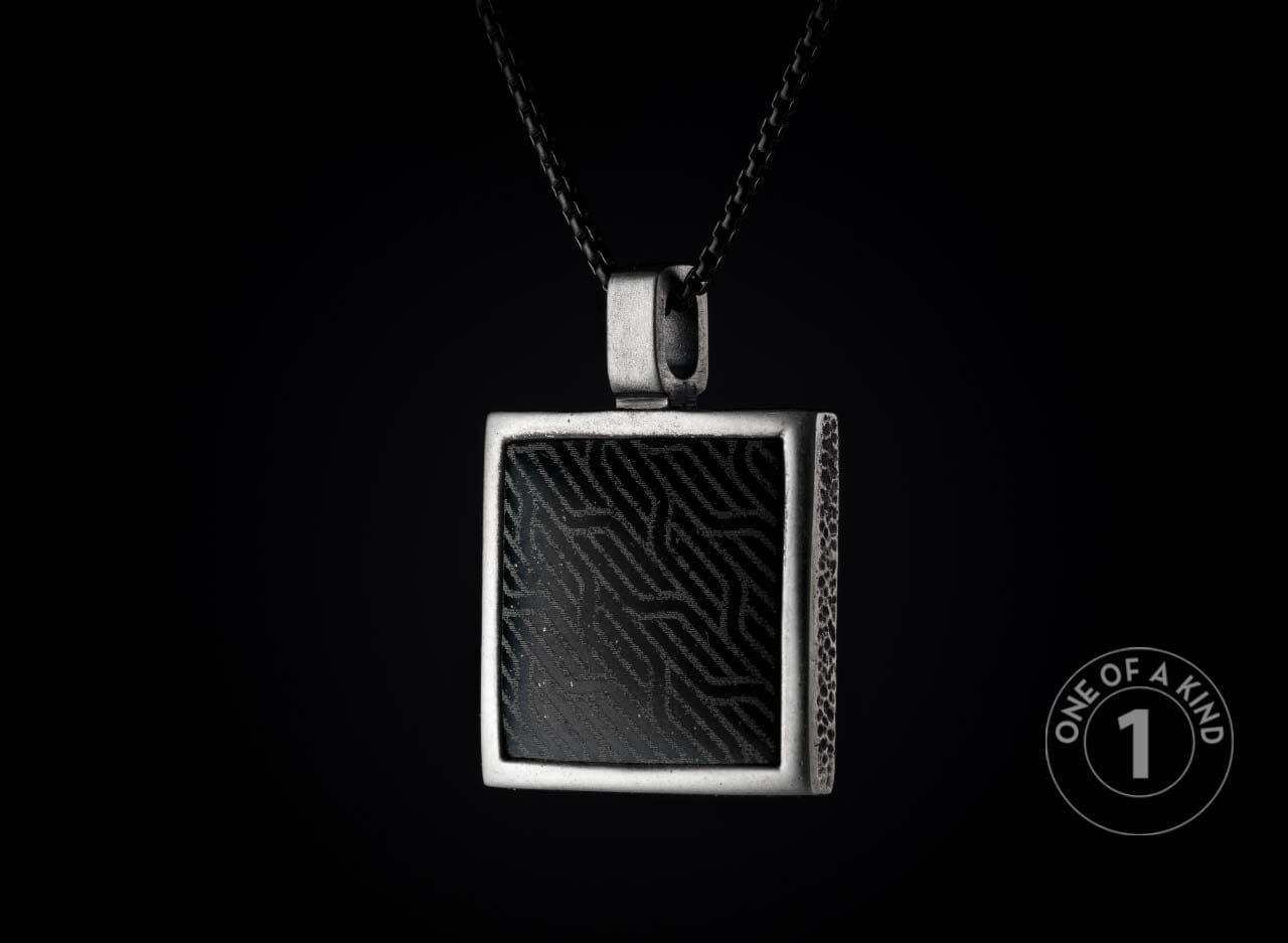 One of a kind sterling silver pendant necklace from William Henry featuring a laser engraved black jade inlay.