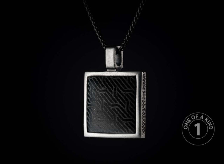 One of a kind sterling silver pendant necklace from William Henry featuring a laser engraved black jade inlay.