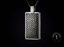 One of a kind sterling silver pendant necklace from William Henry with a laser engraved meteorite inlay.