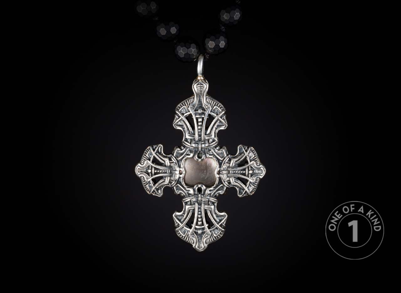 One of a kind rosary style necklace from William Henry featuring a sterling silver cross and pendants with black lip pearl inlays and faceted black onyx beads.