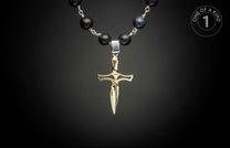 Gold-toned dagger pendant on a dark beaded necklace with silver wire connections.