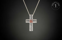 Silver cross pendant necklace with ornate texture, nine central red gemstones, and a "One of a Kind 1" logo.