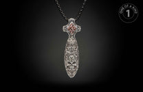 Ornate silver dagger pendant with skull and intricate carvings, featuring a reddish-brown stone inlay, on a dark chain.