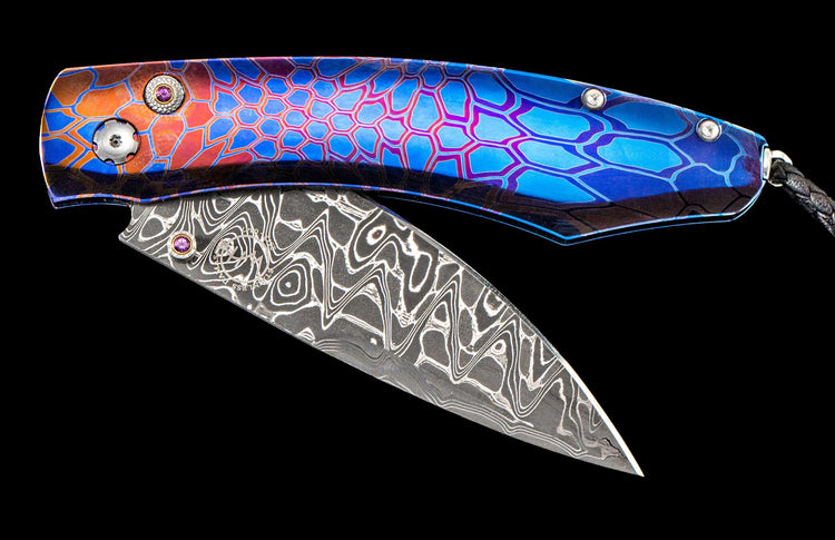 One of a kind William Henry custom knife with Damascus steel, Laser colored titanium, and Amethyst gemstones.