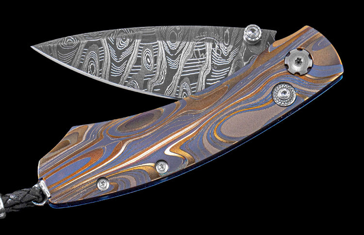 Handcrafted one-of-a-kind William Henry pocket knife featuring a Laser color-engraved titanium frame and hand-forged Damascus steel blade