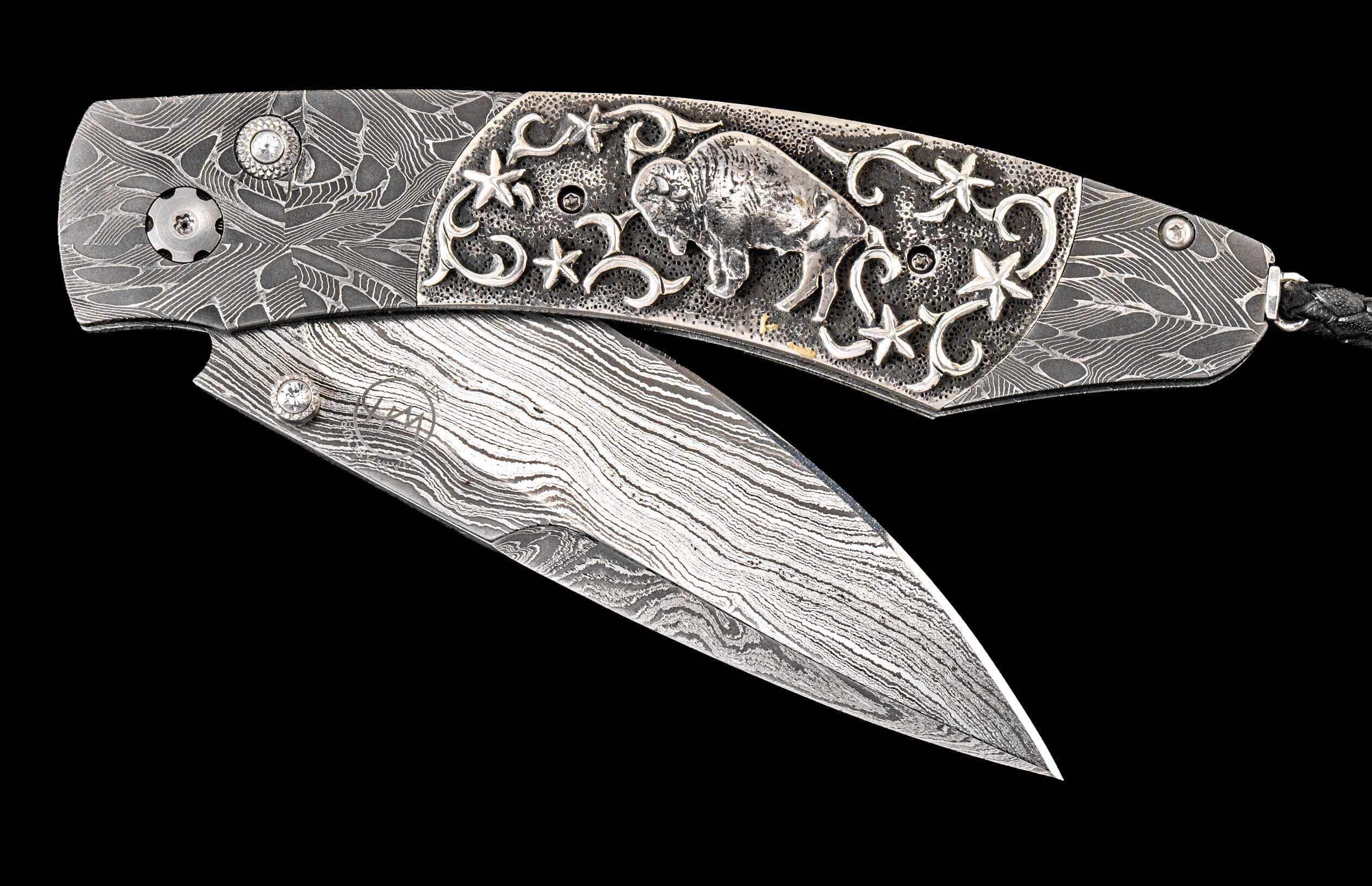 One of a kind custom knife from William Henry with Damascus steel, Hand-carved sterling silver w/Buffalo Nickel, and White topaz