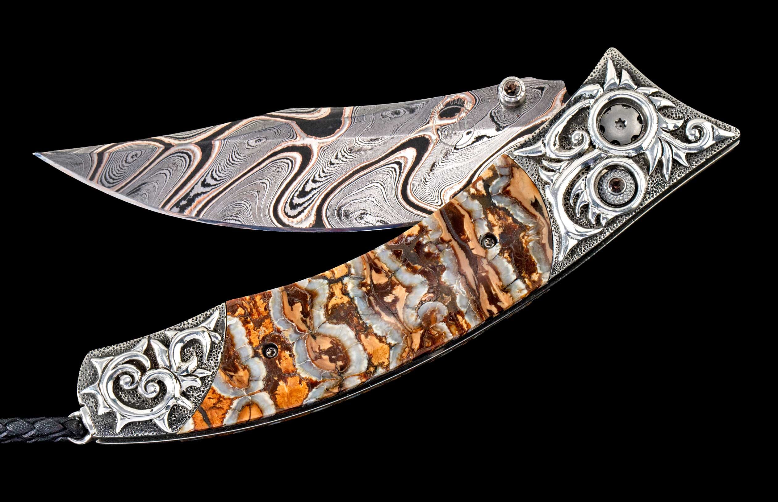 One of a kind William Henry custom knife with hand forged Damascus steel blade, Hand-carved sterling silver, Fossil Mammoth tooth, and Smoky Quartz gemstones.