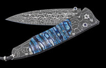 One of a Kind William Henry Custom Knife with damascus steel frame, Fossil Mammoth tooth scales, and damascus blade.