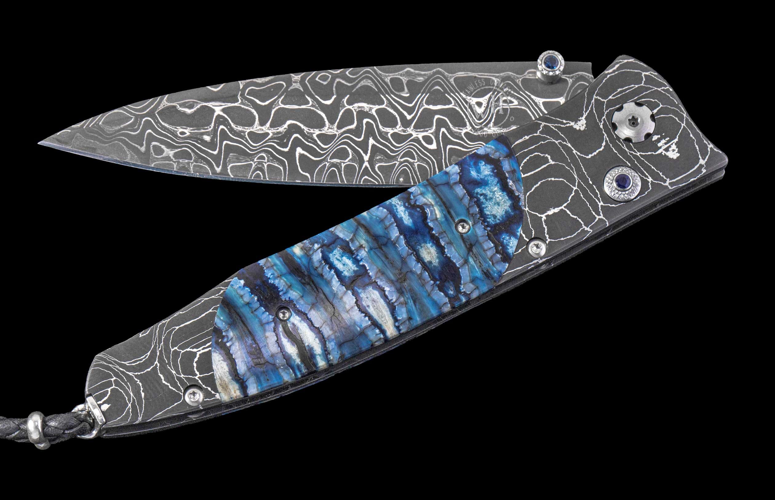 One of a Kind William Henry Custom Knife with damascus steel frame, Fossil Mammoth tooth scales, and damascus blade.