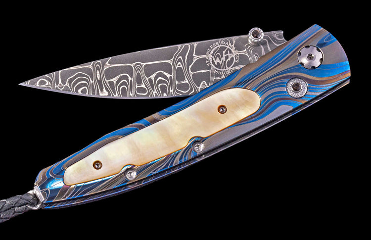 One of a Kind William Henry Custom Knife with Laser-colored titanium frame, Gold lip pearl scales, and hand forged damascus steel blade.
