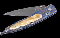 One of a Kind William Henry Custom Knife with Laser-colored titanium frame, Gold lip pearl scales,  Sapphire gems, and damascus steel blade
