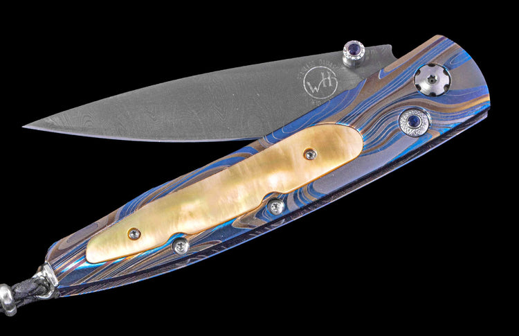 One of a Kind William Henry Custom Knife with Laser-colored titanium frame, Gold lip pearl scales,  Sapphire gems, and damascus steel blade
